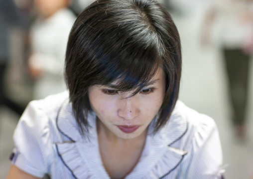 North Korean woman on a car simulator in Kaeson youth park, DGC, Pyongyang, North Korea