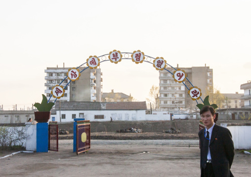 Man in front of Tchang Gwang school playground, North Hamgyong, Chongjin, North Korea
