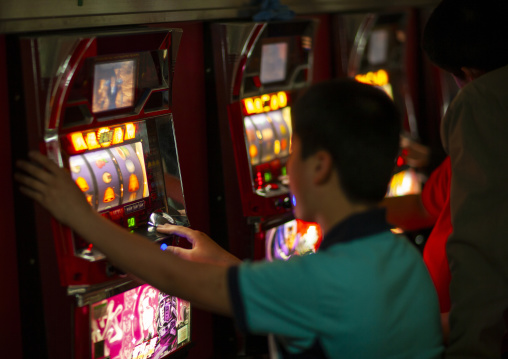 North Korean people playing slot machines in a casino, DGC, Pyongyang, North Korea