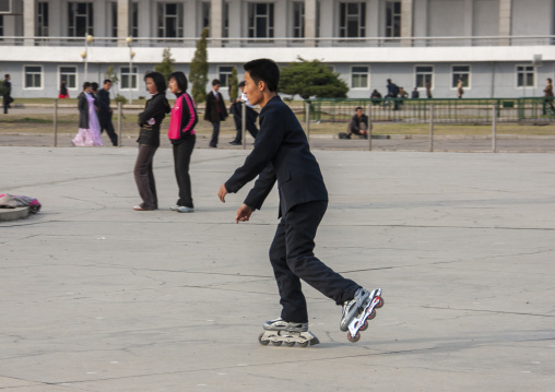 North Korean boy roller skating in town, DGC, Pyongyang, North Korea