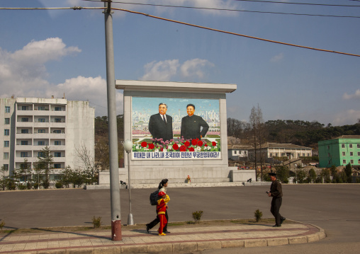 North Korean propaganda billboard with the leaders in the street, DGC, Pyongyang, North Korea