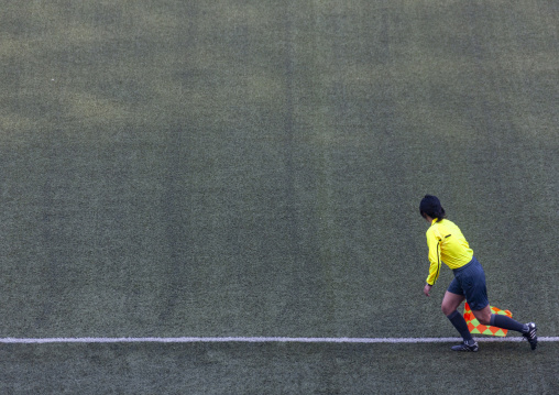 Line referee in Kim il Sung stadium during a football game, DGC, Pyongyang, North Korea