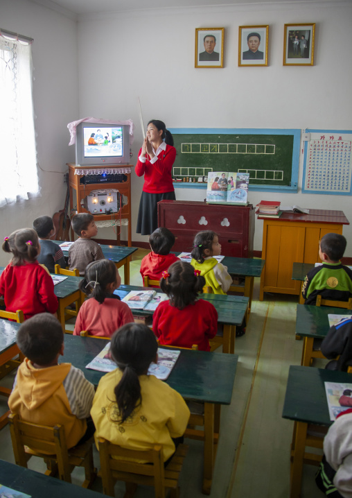 Pupils with a teacher in a classroom, South Pyongan, Chongsan-ri Cooperative Farm, North Korea