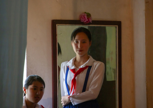 North Korean pioneers teenage girls backstage before a show in a college, DGC, Pyongyang, North Korea