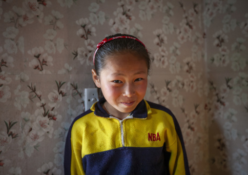 Portrait of a North Korean girl in her house, Kangwon, Chonsam Cooperative Farm, North Korea