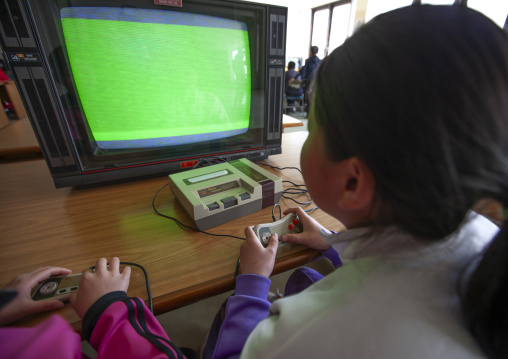 Children playing video games in Songdowon international children's camp, Kangwon Province, Wonsan, North Korea