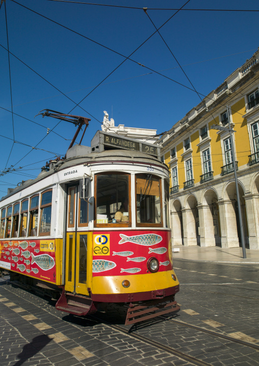 Famous vintage yellow tram 25 in the street, Lisbon district, Lisbon, Portugal