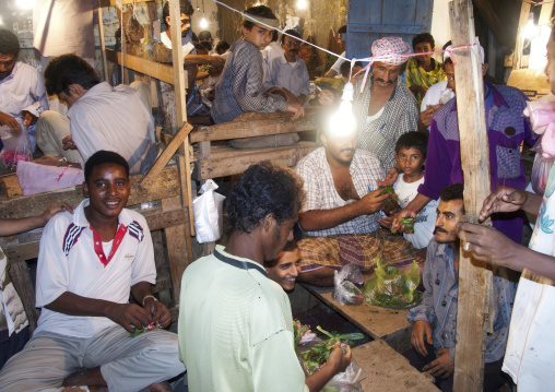 Qat sellers at night market, Al Hudaydah Governorate, Hodeidah, Yemen