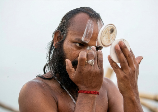 Naga Sadhu make up in Maha Kumbh Mela, Uttar Pradesh, Allahabad, India