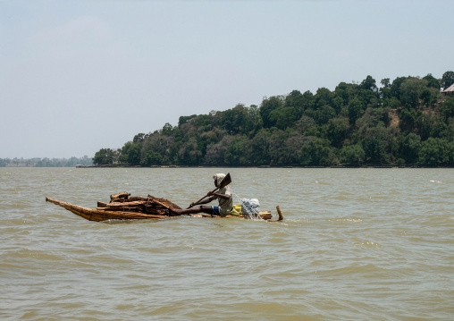Man on a papyrus boat on a lake, Amhara region, Lake Tana, Ethiopia