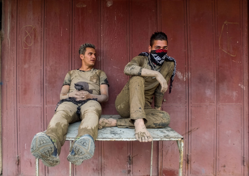 Iranian shiite men with mud during tasua celebration, Lorestan, Khorramabad, Iran