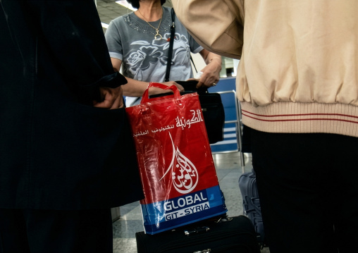 North Korean woman with a GIT Syria bag, DGC, Pyongyang, North Korea
