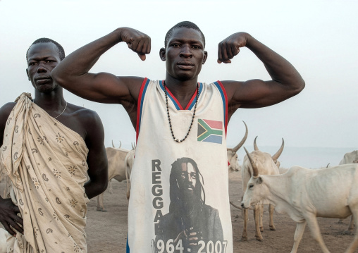 A Mundari tribe man mimics the position of horns of his favourite cow, Central Equatoria, Terekeka, South Sudan