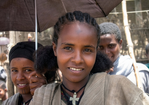 Ethiopian young woman under an umbrella, Amhara Region, Lalibela, Ethiopia