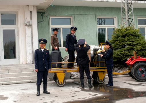 Tractor trailer at Samjiyon airport picking up luggages, Ryanggang, Samjiyon, North Korea