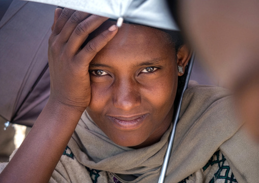 Ethiopian woman under an umbrella, Amhara Region, Lalibela, Ethiopia