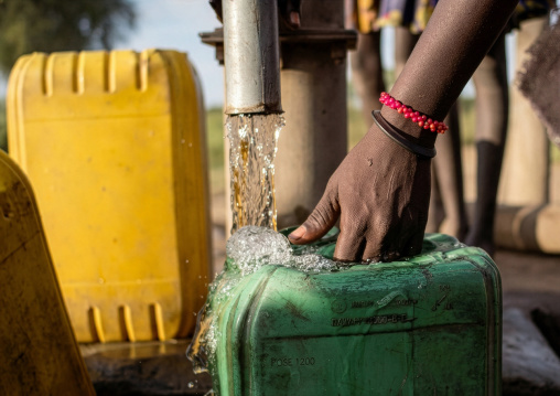 Mundari tribe woman pumping water in a well, Central Equatoria, Terekeka, South Sudan