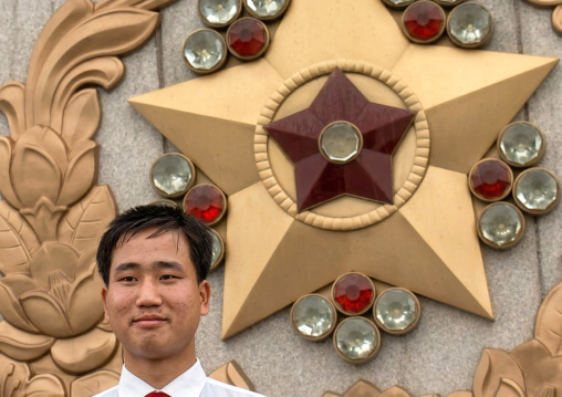North Korean man under the rain in Kumsusan memorial palace, DGC, Pyongyang, North Korea