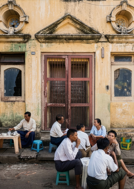 Burmese people eating in an outdoor restaurant, Yangon region, Yangon, Myanmar