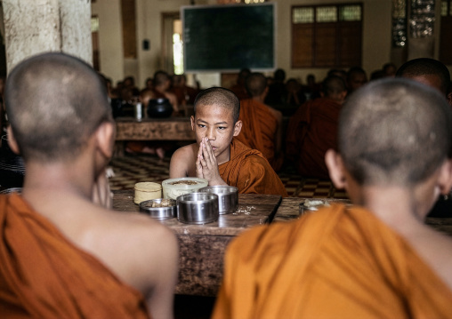 Young novices praying before eating, Mrauk U, Myanmar