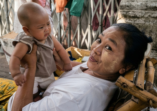 Mother holding her baby, Yangon region, Yangon, Myanmar