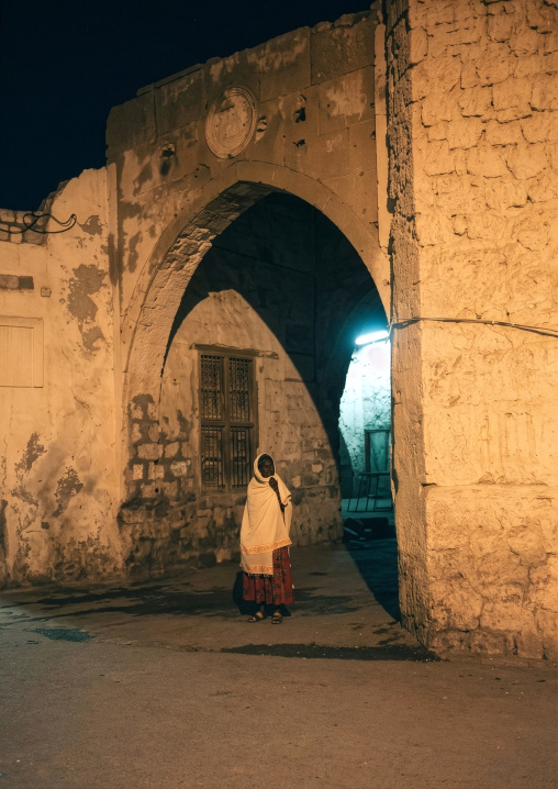 Eritrean woman at the entrance of the former market, Northern Red Sea, Massawa, Eritrea