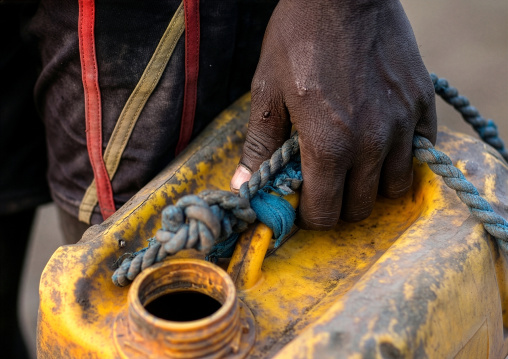 Mundari tribe woman with a jerrican full of water, Central Equatoria, Terekeka, South Sudan