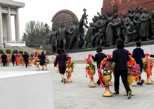 People bringing flowers to the statues of the Leaders in the Grand monument, DGC, Pyongyang, North Korea