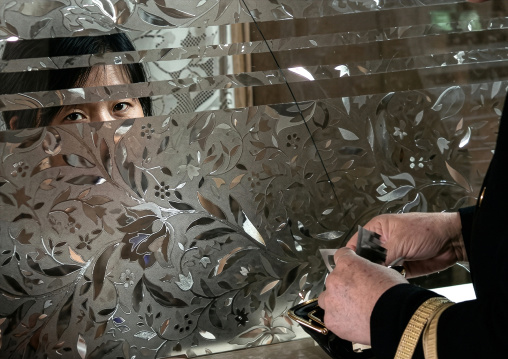 Cashier at the casino, DGC, Pyongyang, North Korea