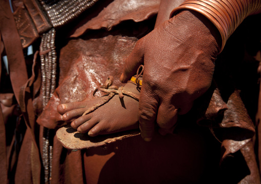 Hand Of A Muhimba Woman Holding A Baby Foot, Village Of Elola, Angola