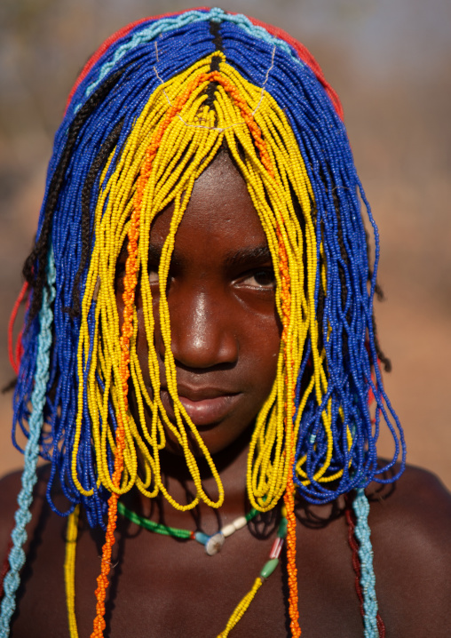 Portrait of a Mudimba tribe girl with a beaded wig during the fico ceremony, Cunene Province, Cahama, Angola