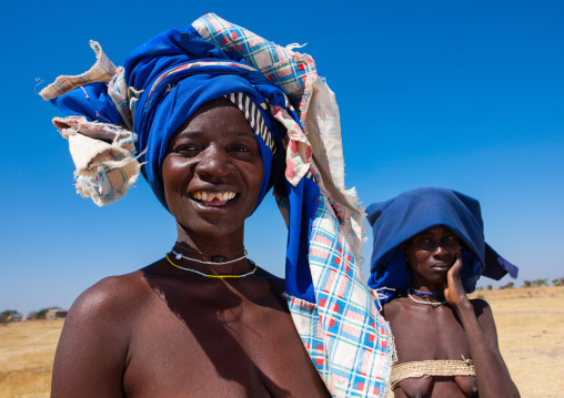 Mucubal tribe women wearing blue headwears, Namibe Province, Virei, Angola