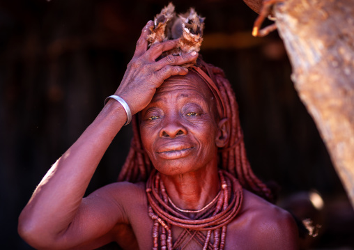 Portrait of a Himba tribe woman covered with otjize, Cunene Province, Oncocua, Angola