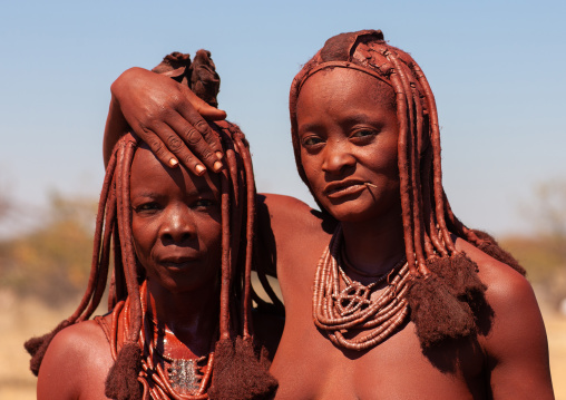 Himba tribe women covered with otjize, Cunene Province, Oncocua, Angola