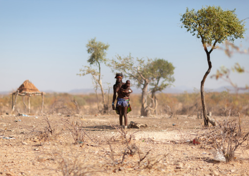 Muhacaona mother with her child in the bush, Cunene Province, Oncocua, Angola