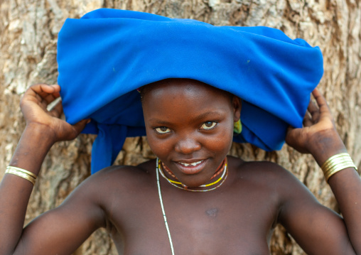 Mucubal tribe young woman wearing a blue headwear, Namibe Province, Virei, Angola