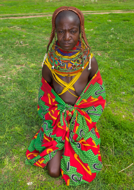 Mumuhuila tribe woman portrait in a field, Huila Province, Chibia, Angola