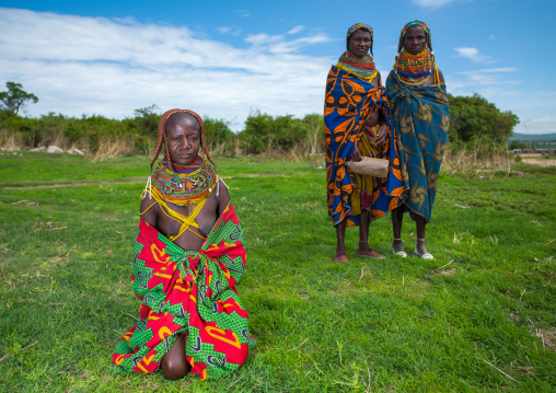 Mumuhuila tribe women in a field, Huila Province, Chibia, Angola