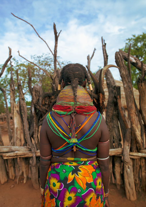 Rear view of a Mumuhuila tribe woman, Huila Province, Chibia, Angola