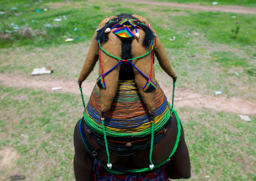 Rear view of a Mumuhuila tribe woman, Huila Province, Chibia, Angola