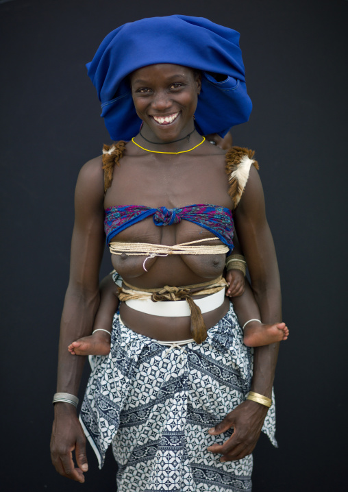 Mucubal Woman With Her Baby Sticking Out From Her Back, Virie Area, Angola