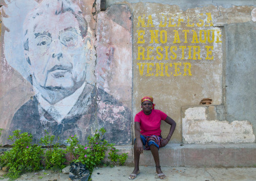 Woman In Front Of An Old Propaganda Wall Painting With Leonid Brejnev, Bilaiambundo Angola