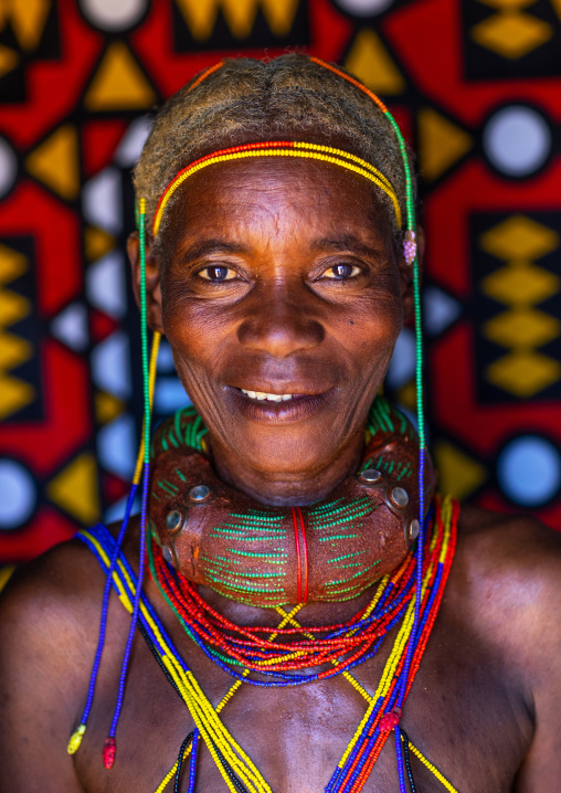 Mungambue tribe woman with the traditional hairtsyle and necklace, Huila Province, Chibia, Angola