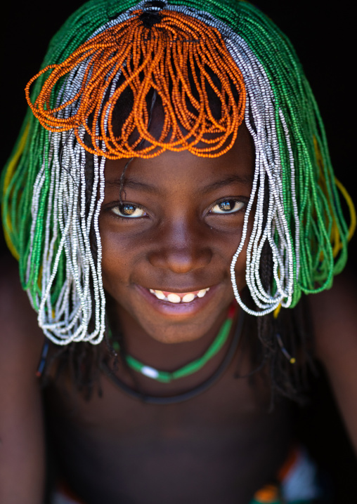 Muhakaona tribe girl with a beaded wig used for the fico ceremony, Cunene Province, Oncocua, Angola