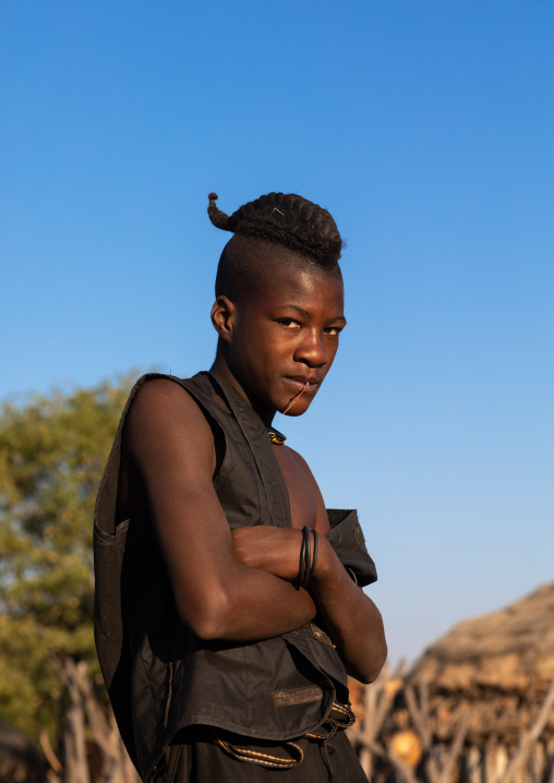 Himba tribe man with a special hairstyle which shows he is single, Cunene Province, Oncocua, Angola