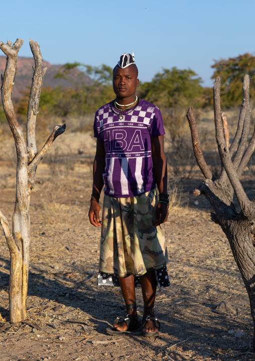 Himba tribe man with a special hairstyle which shows he is single, Cunene Province, Oncocua, Angola