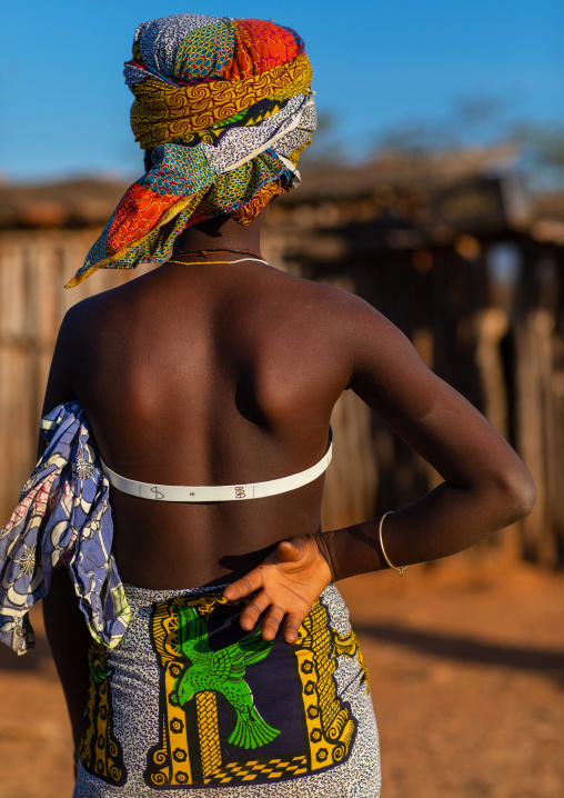 Rear view of a Nguendelengo tribe woman, Namibe Province, Capangombe, Angola