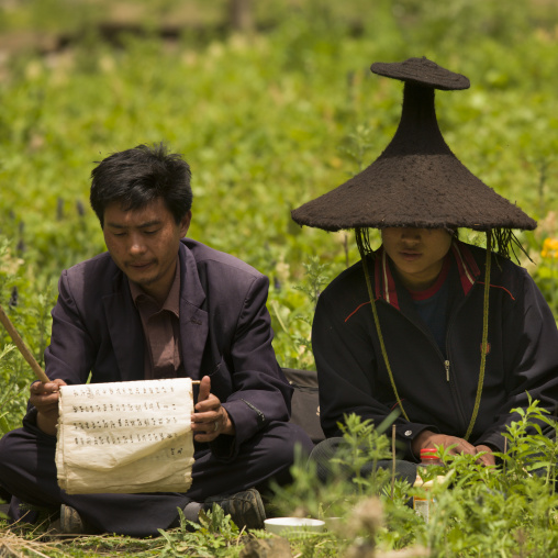 Shaman During A Ceremony, Lugu Lake, Yunnan Province, China