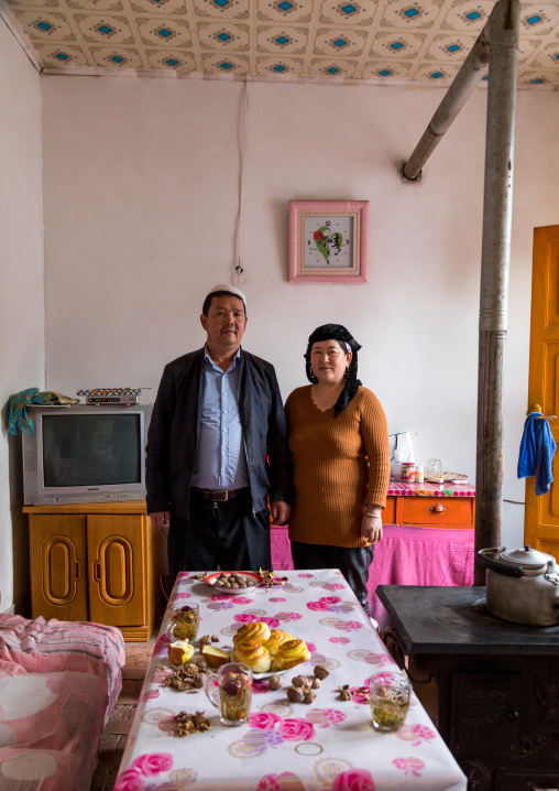 Salar ethnic minority couple inside their house, Qinghai province, Xunhua, China