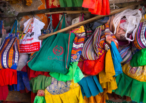 Tibetan nomads pilgrims bags ful of offerings at the entrance of Rongwo monastery, Tongren County, Longwu, China